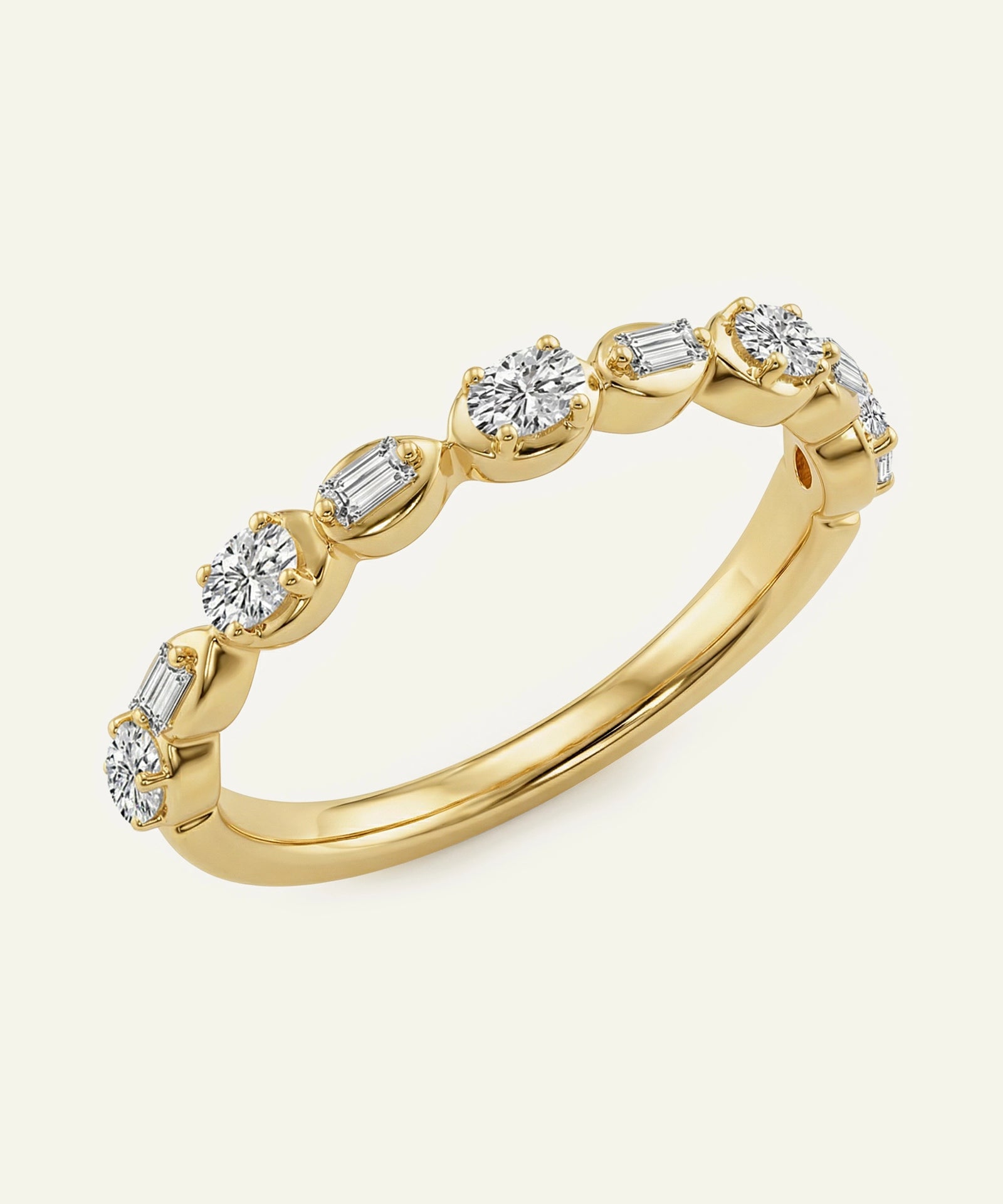 Gold ring with diamond stones on a light beige background