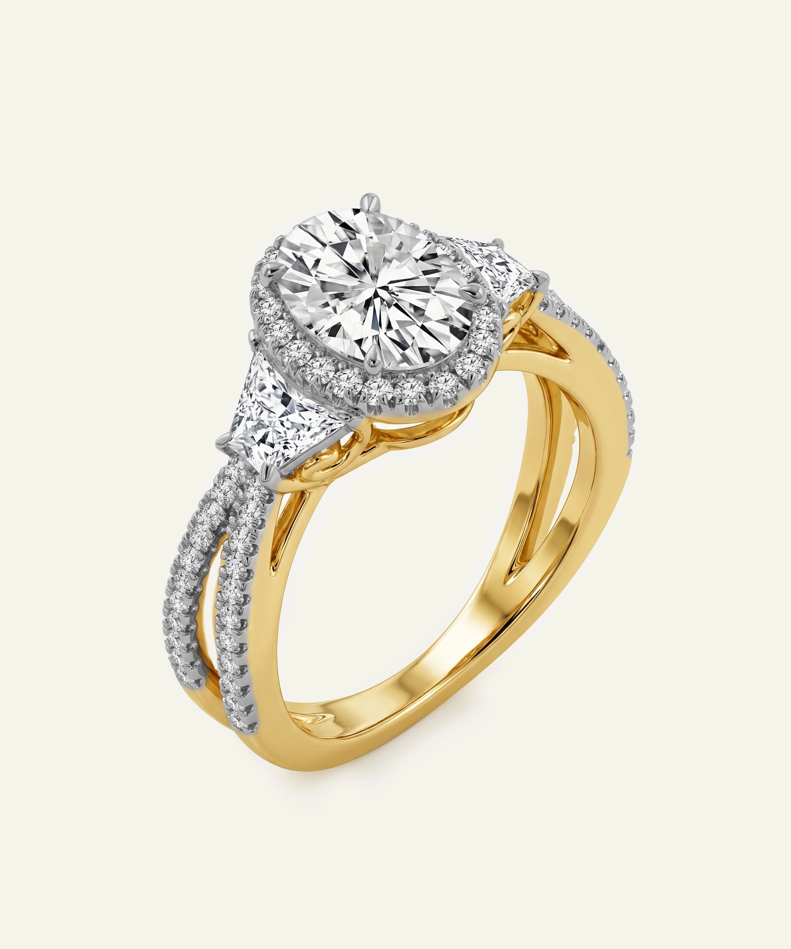 Gold and silver diamond ring on a light grey background