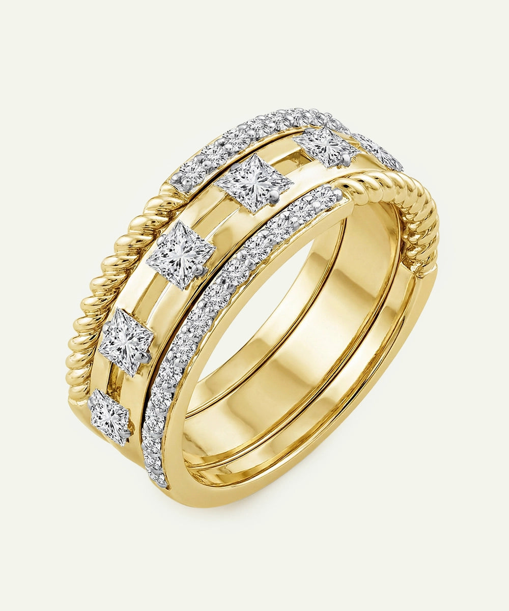 Gold ring with diamond accents on a white background
