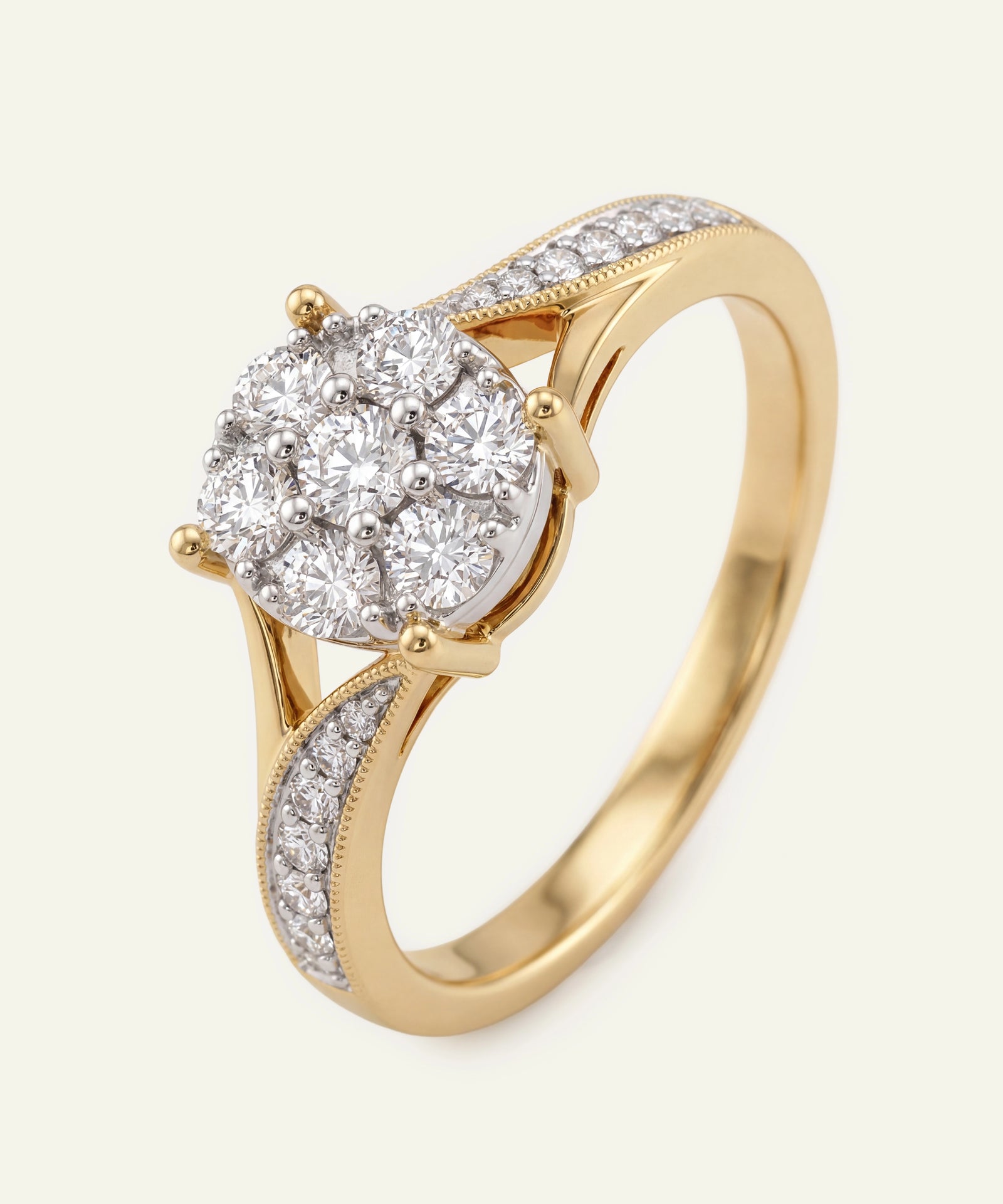 Gold ring with a diamond on a light gray background