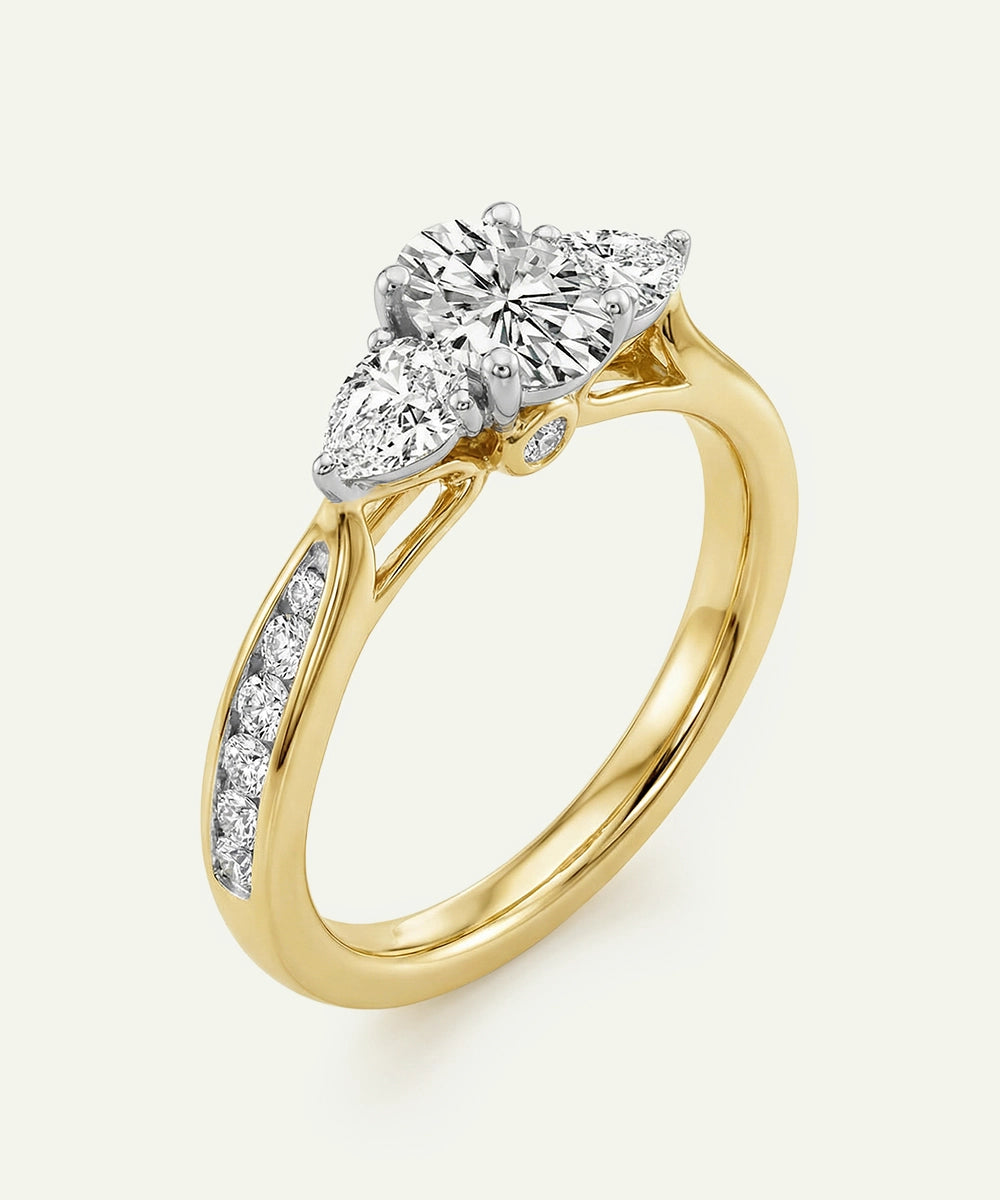 Gold ring with three diamond stones on a white background