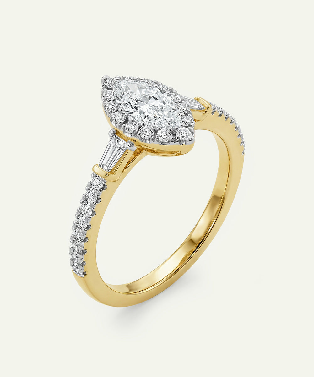 Gold ring with a diamond on a white background