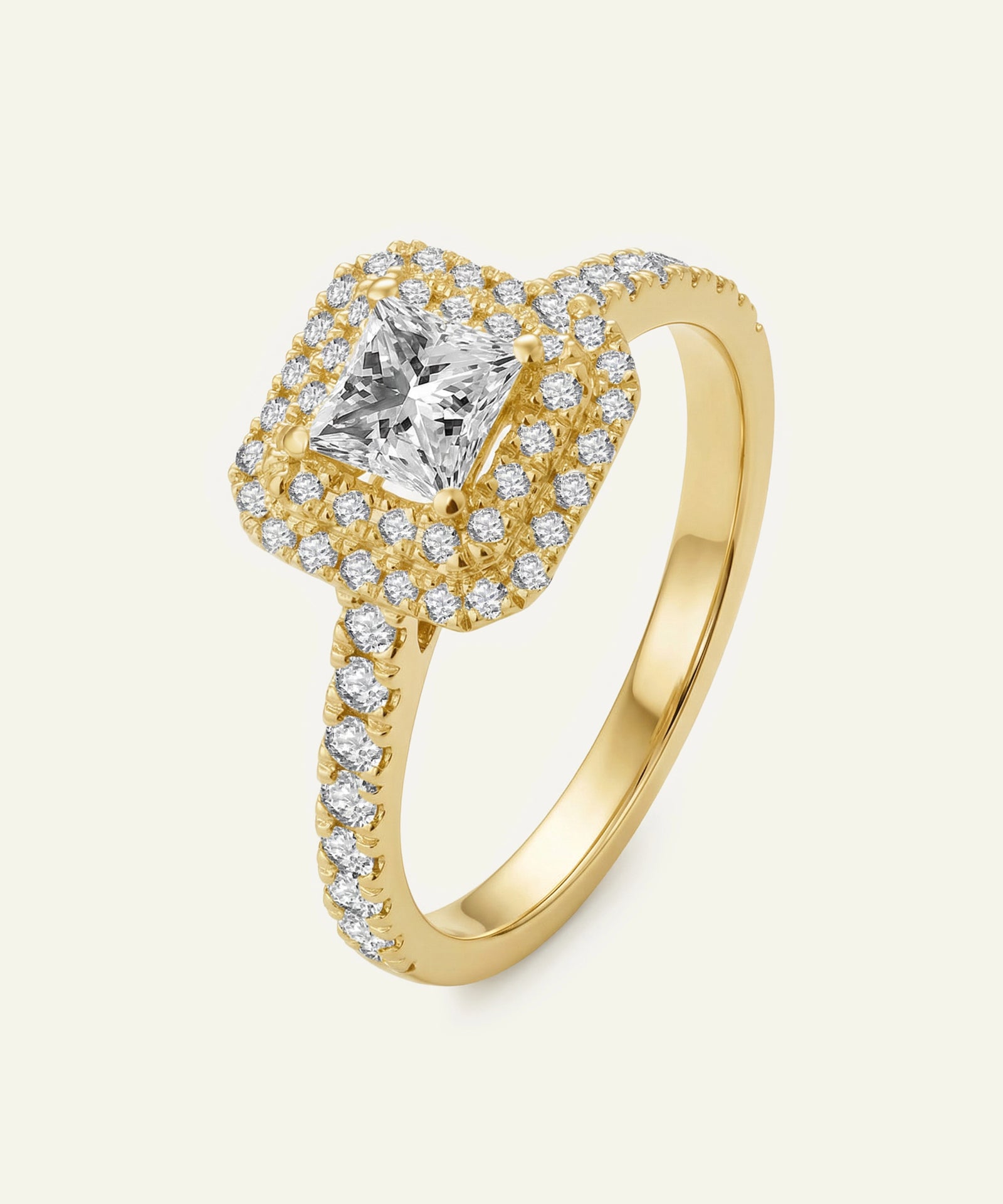 Gold ring with a central diamond and smaller diamonds on a light beige background