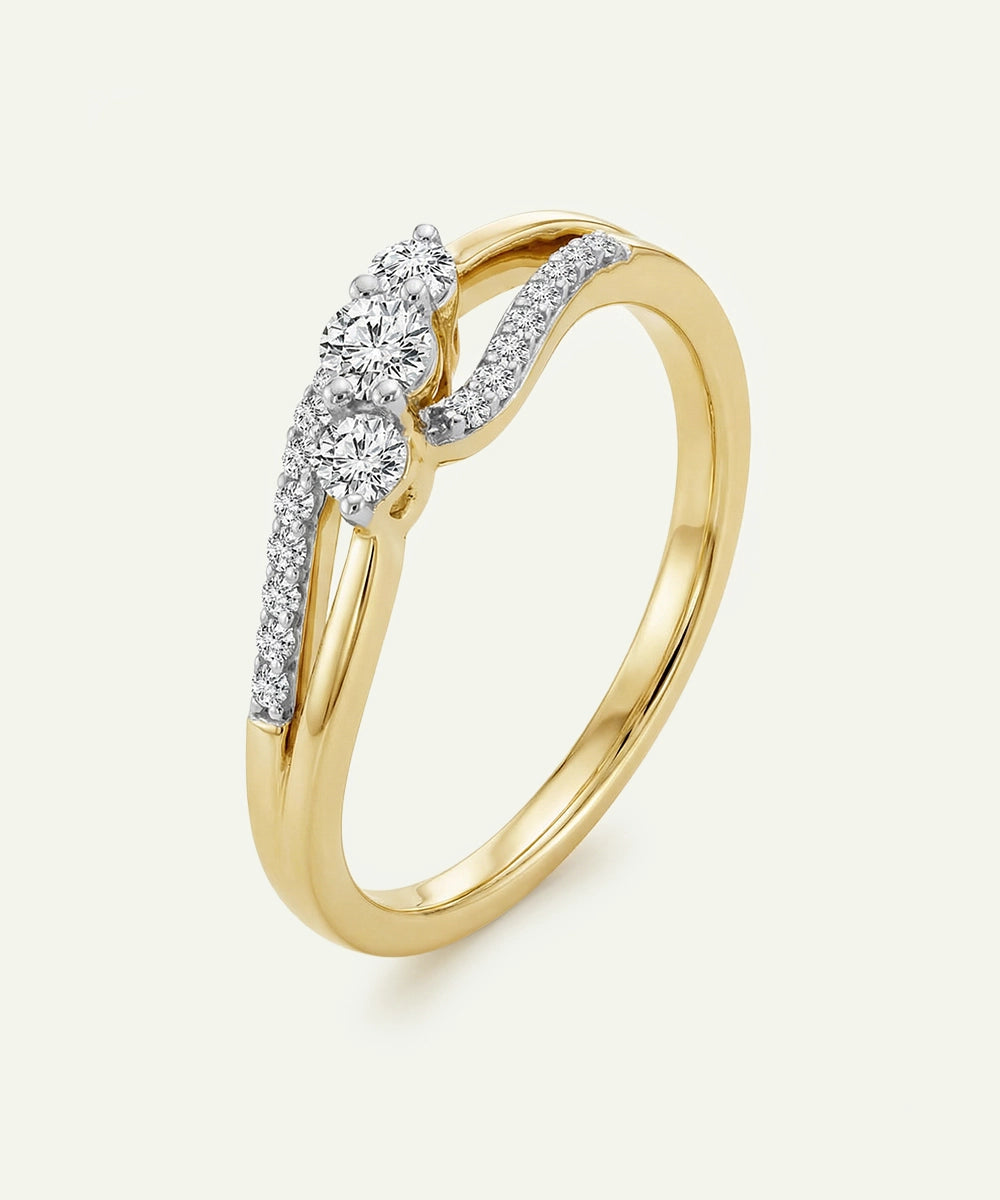 Gold ring with diamond accents on a white background