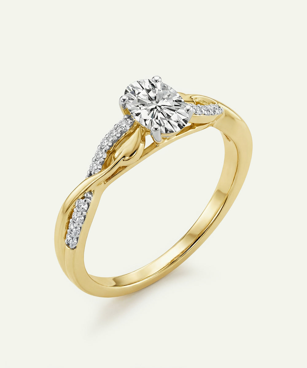 Gold ring with a diamond on a white background