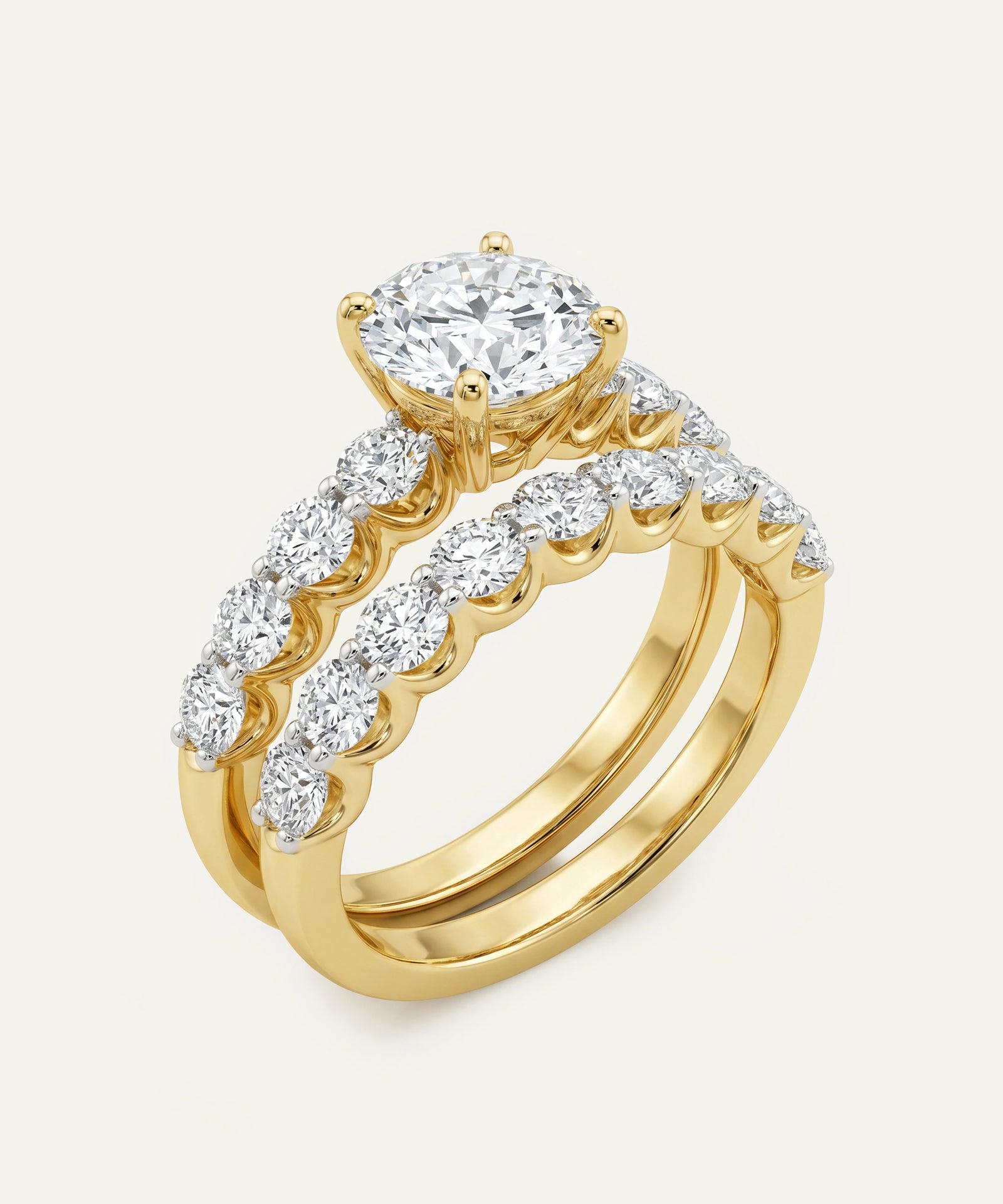 Gold ring with diamond accents on a white background