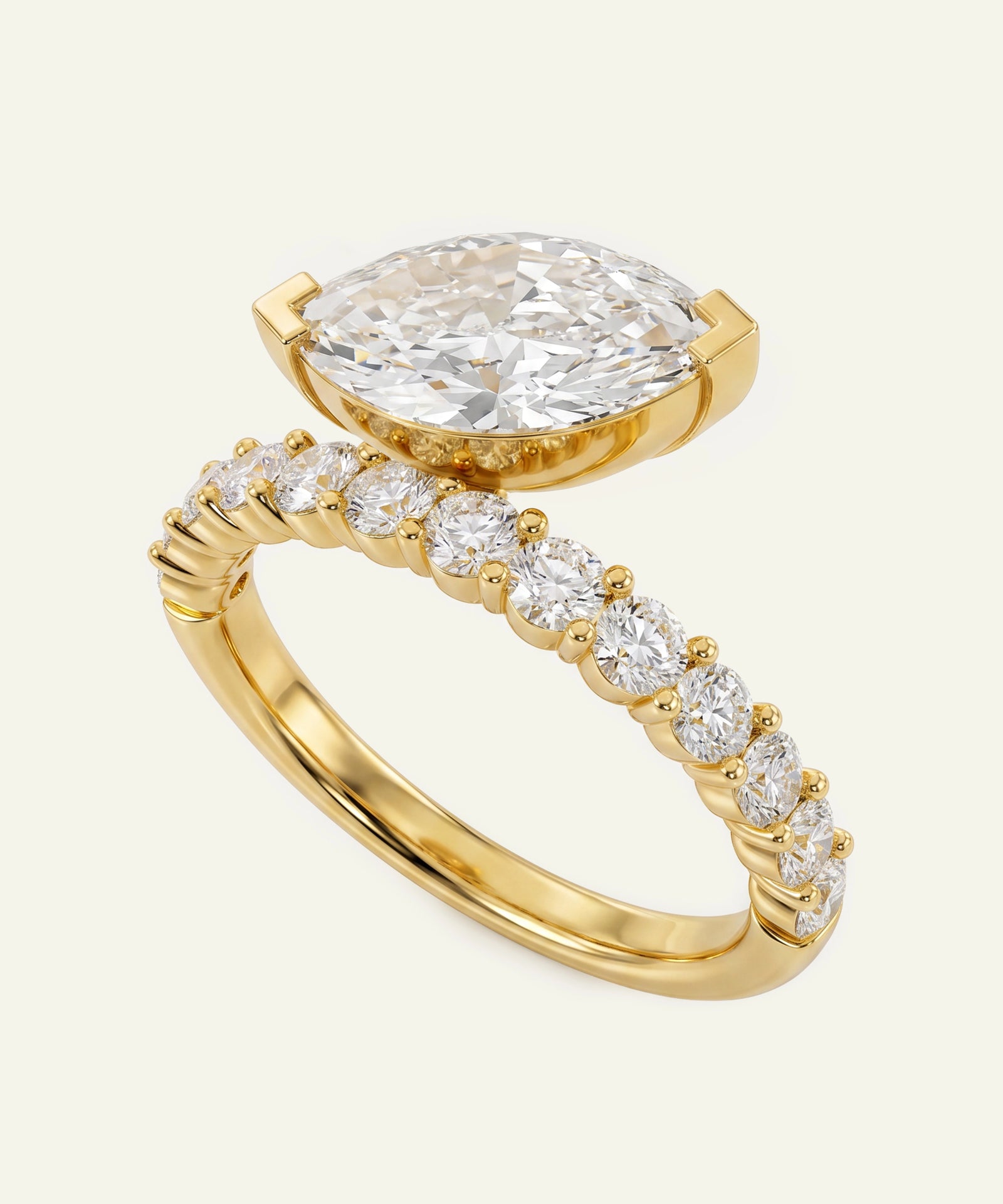 Gold ring with a large diamond and smaller diamonds on a white background
