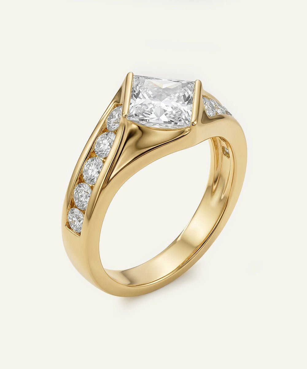 Gold ring with a large diamond and smaller diamonds on a light gray background