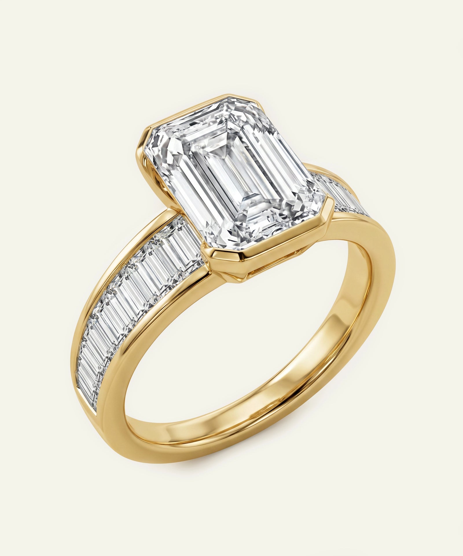 Gold ring with emerald-cut diamond on a white background
