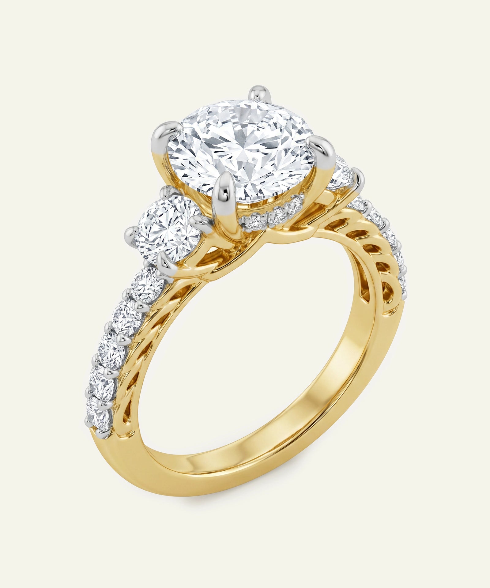 Gold ring with a large diamond and smaller diamonds on the band against a white background