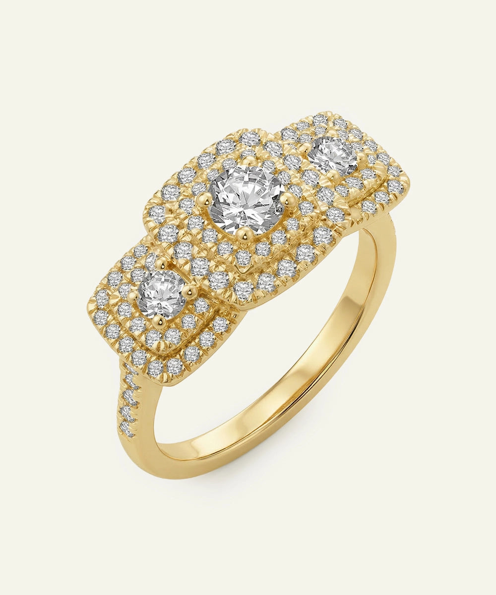 Gold ring with diamond accents on a light beige background
