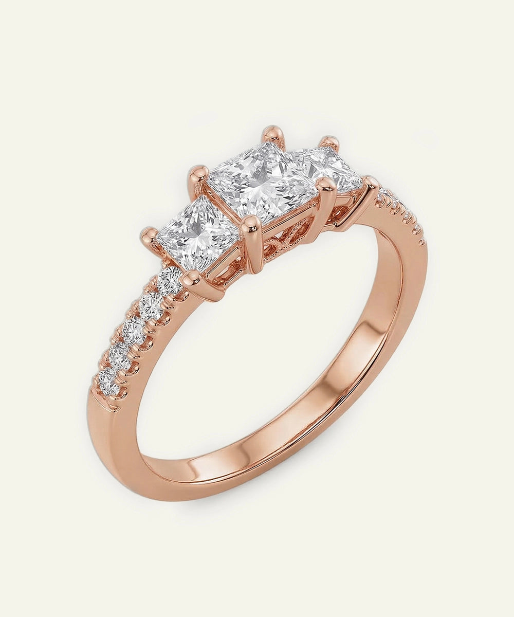Rose gold ring with diamonds on a white background