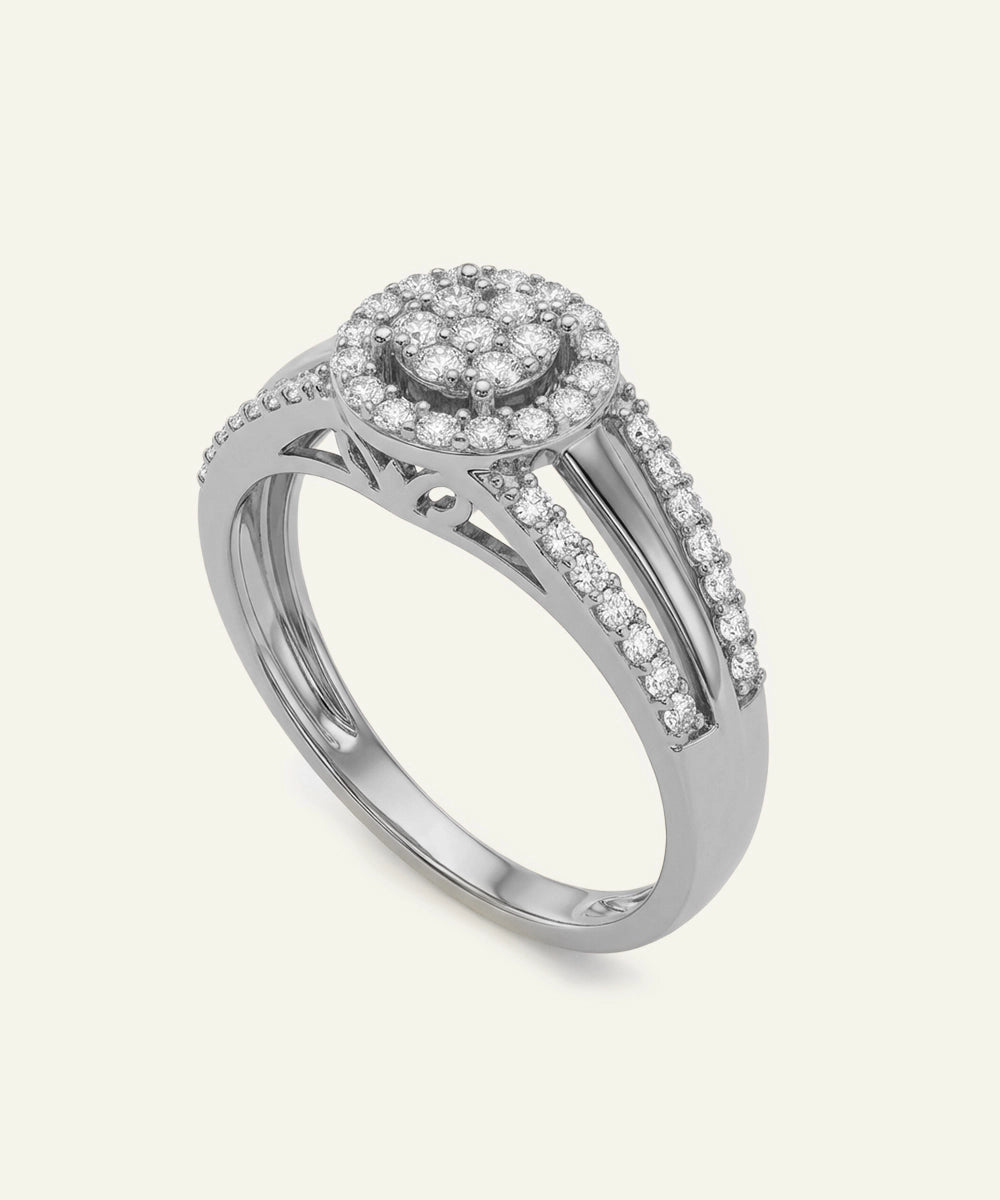 Silver ring with diamond accents on a light gray background