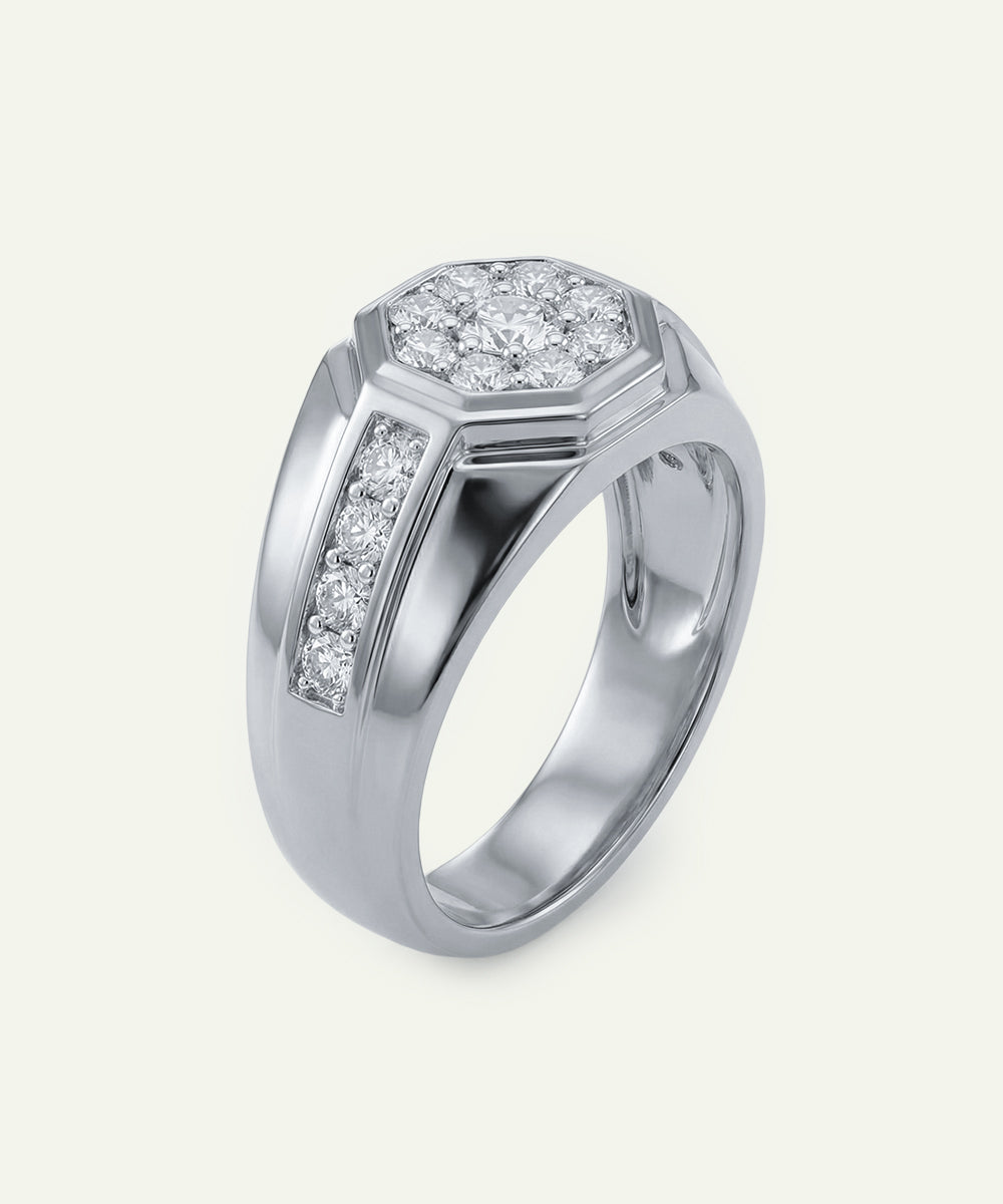 Silver ring with diamond accents on a light gray background