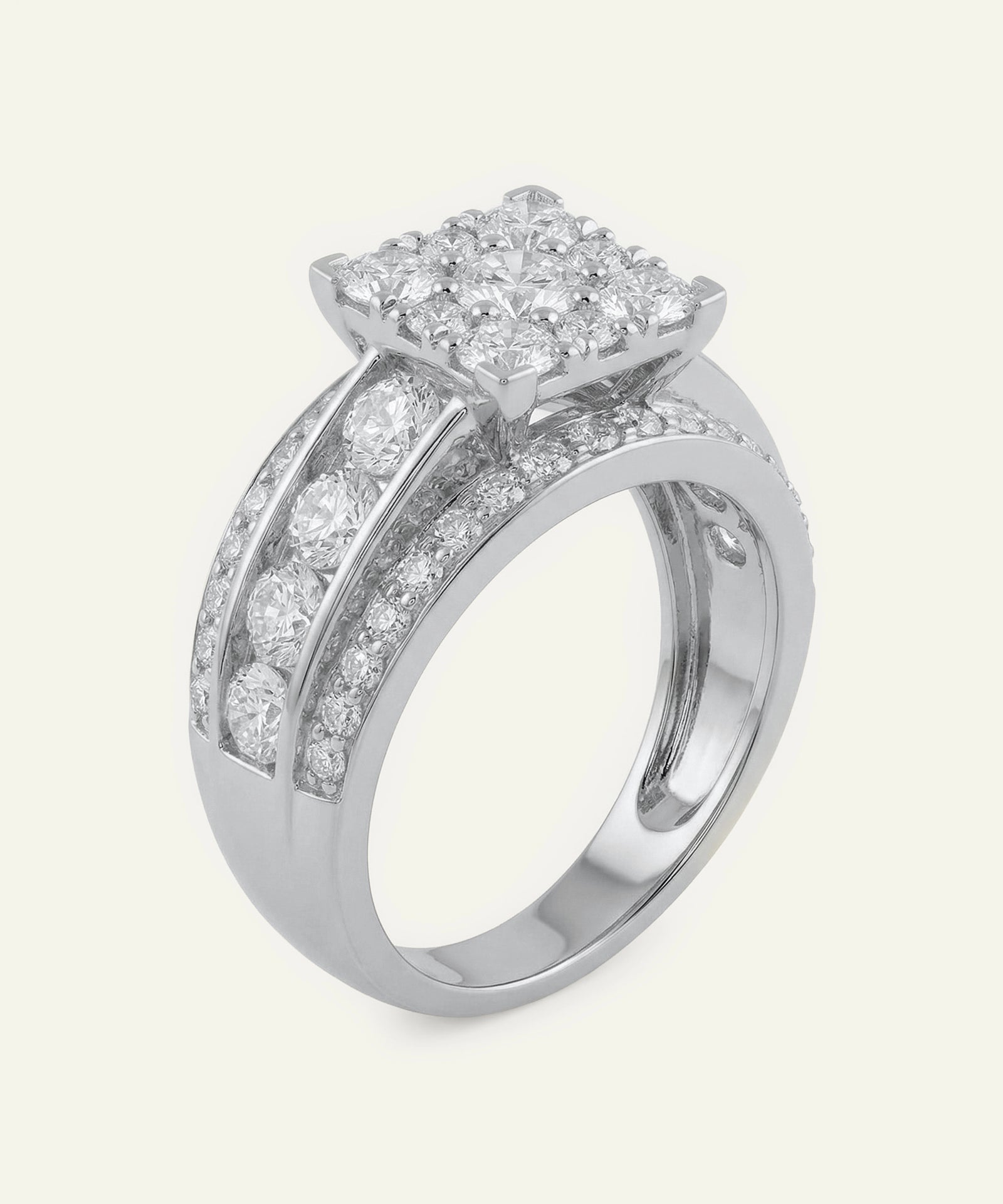 Silver ring with diamond accents on a light gray background