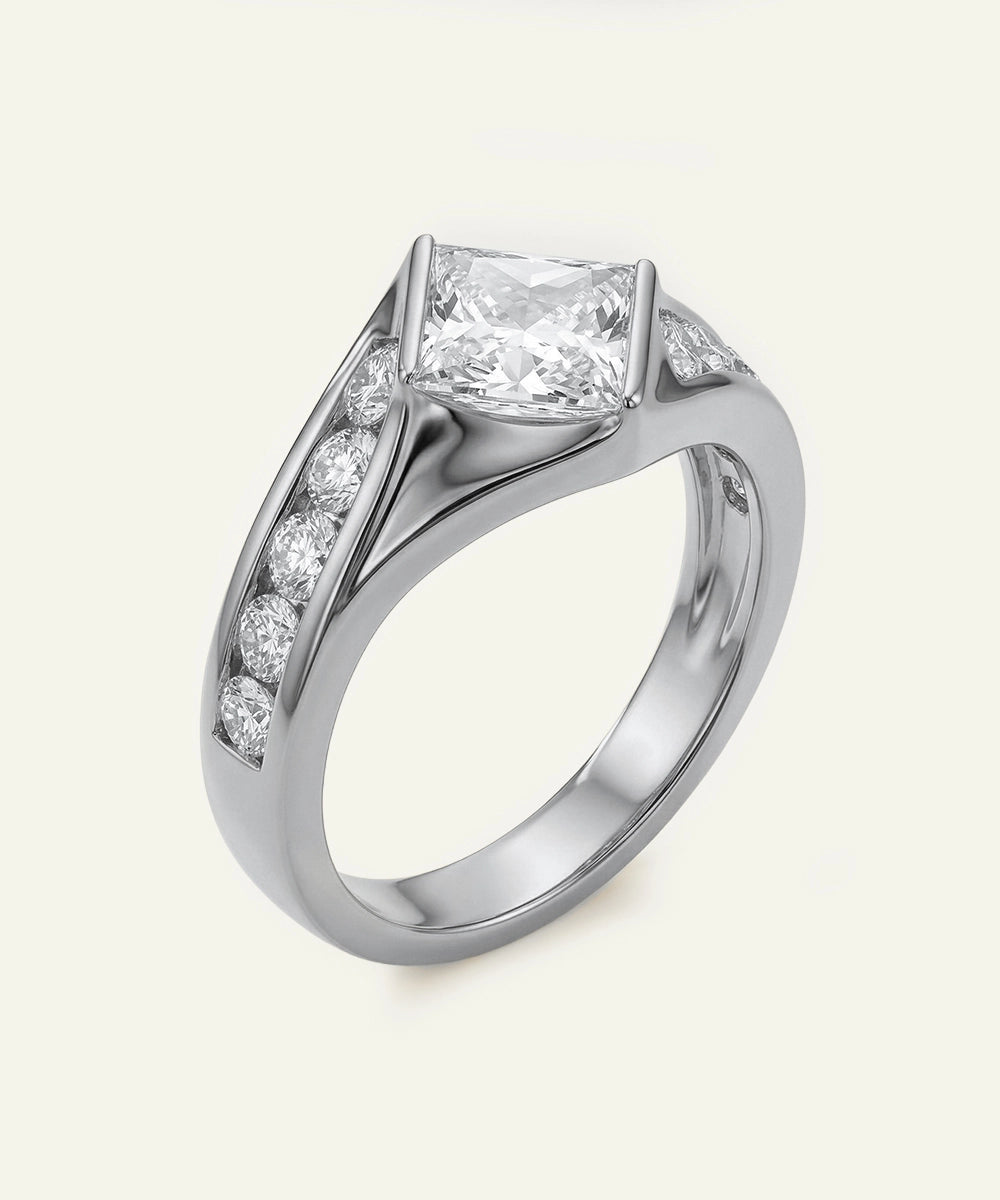 Diamond ring with a central princess-cut diamond and smaller diamonds on a light background