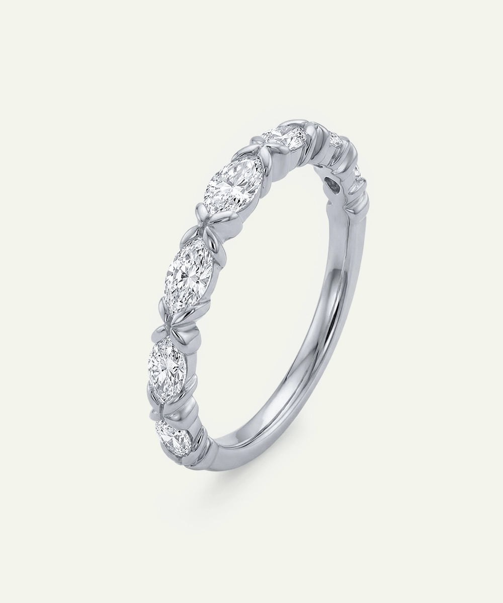 Silver ring with diamond stones on a white background