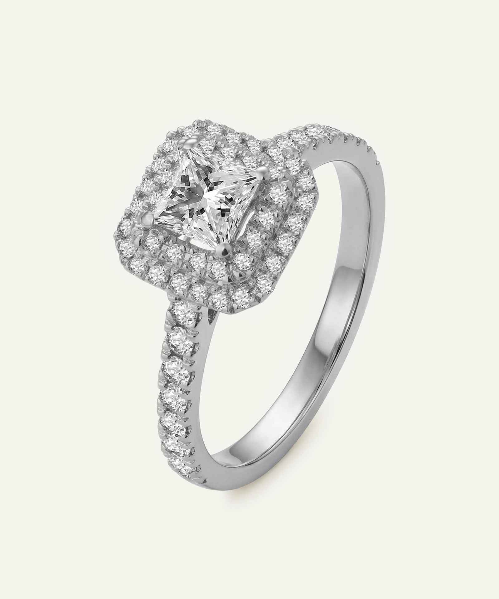 Diamond ring with a white gemstone on a light gray background