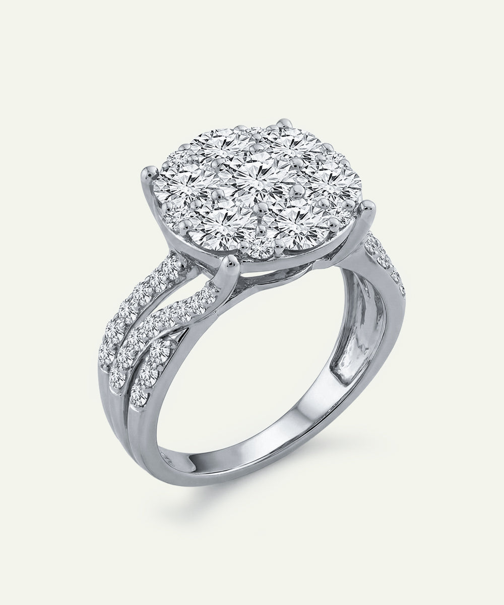 Diamond ring with a white gold band on a light gray background