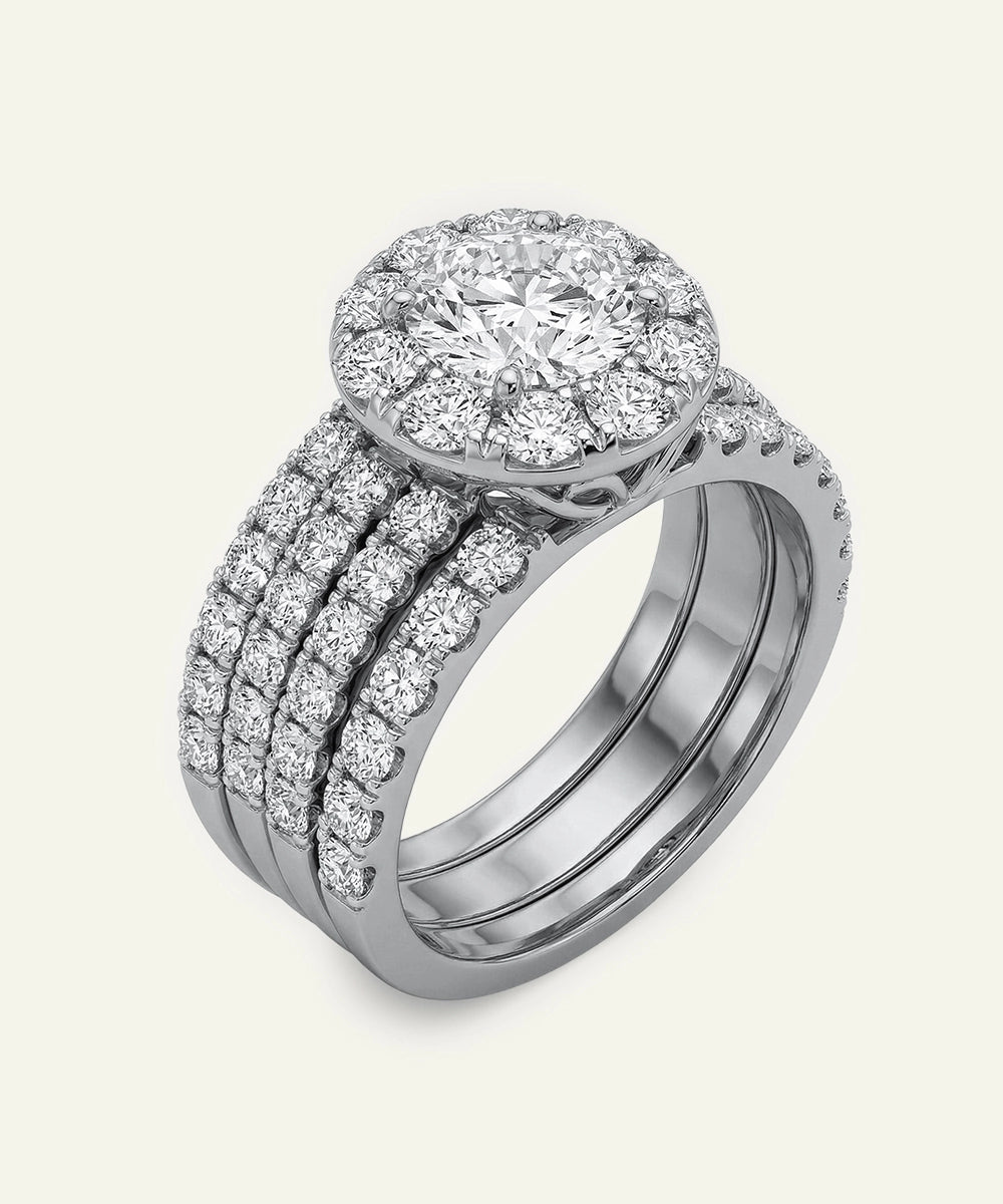 Diamond ring with a halo setting on a white background