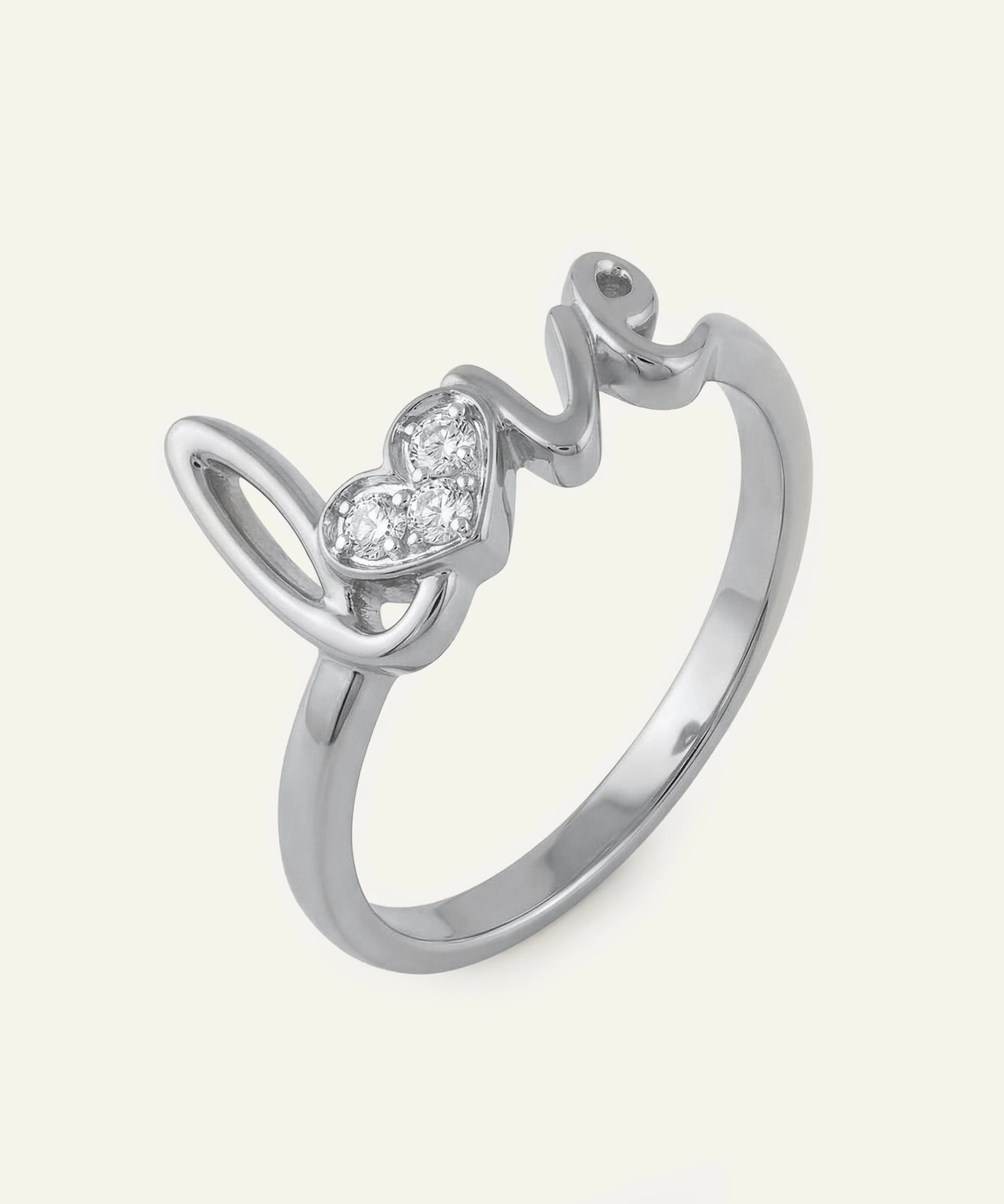Silver ring with heart-shaped gemstone on a white background