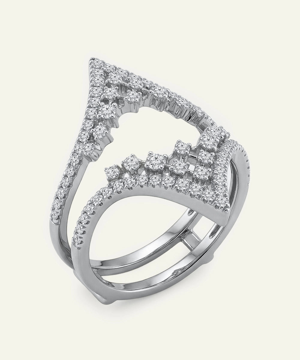 Silver ring with diamond accents on a white background