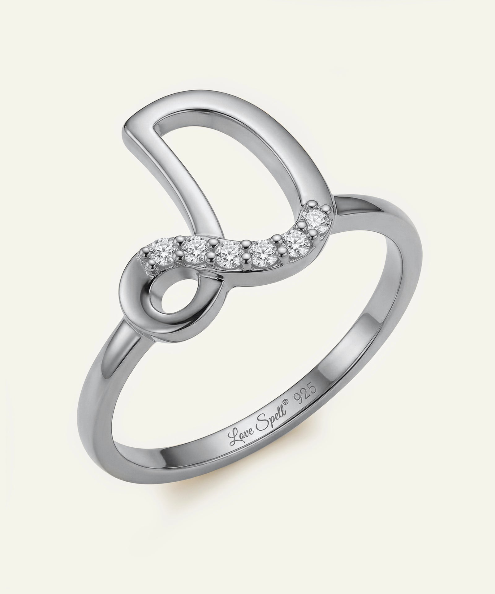 Silver ring with diamond accents on a white background