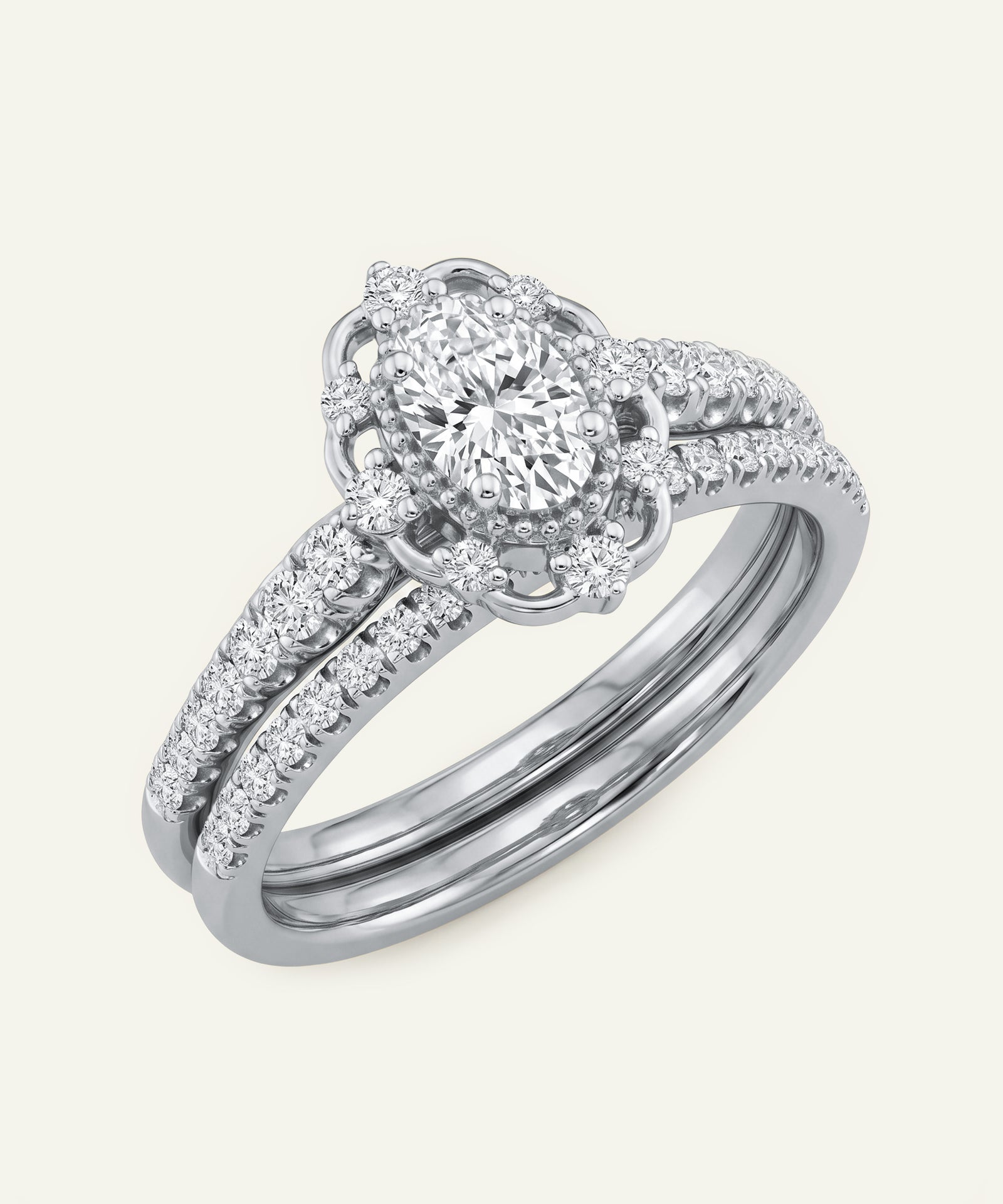 Diamond ring with a white gold band on a light gray background