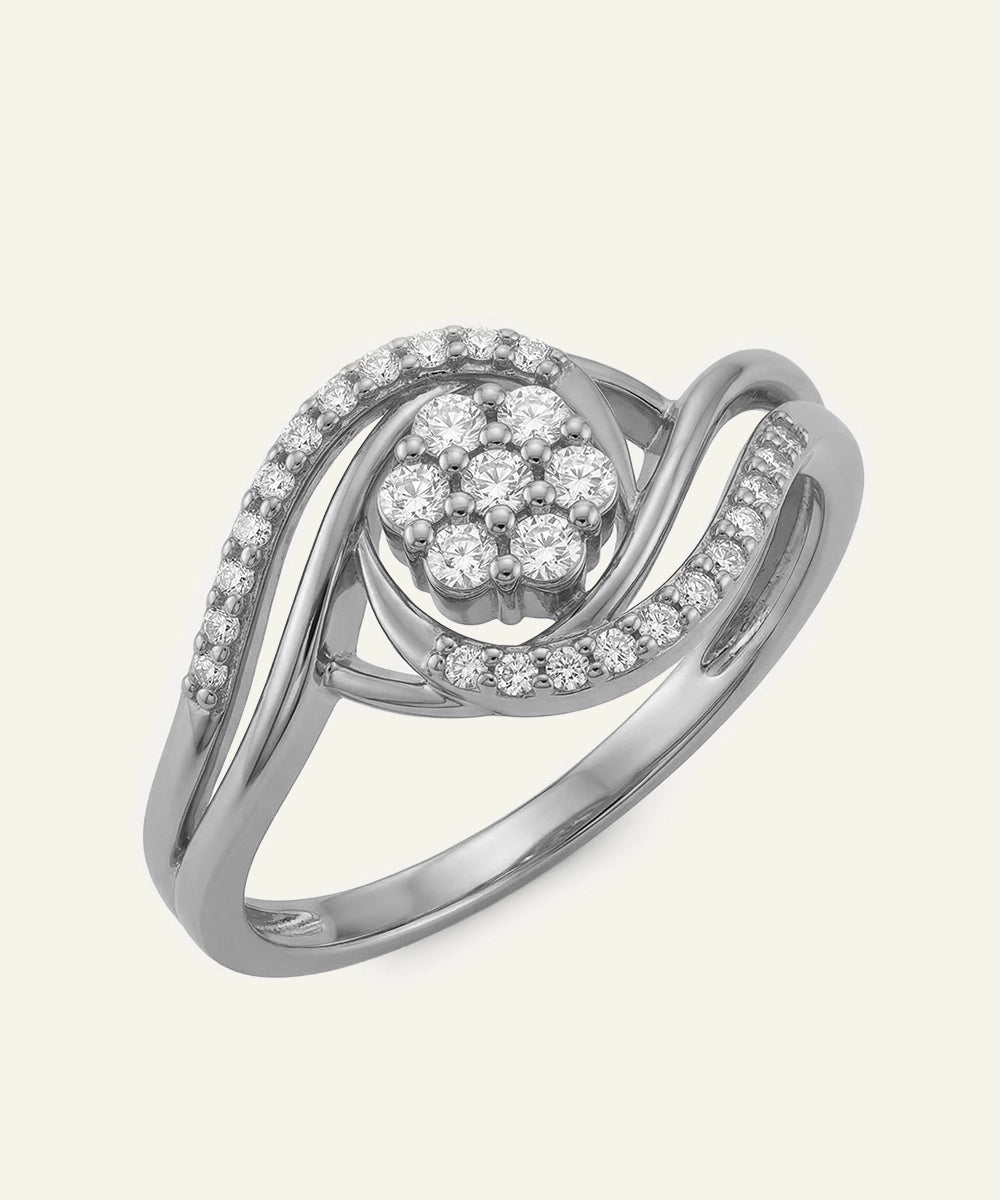 Silver ring with diamond accents on a white background