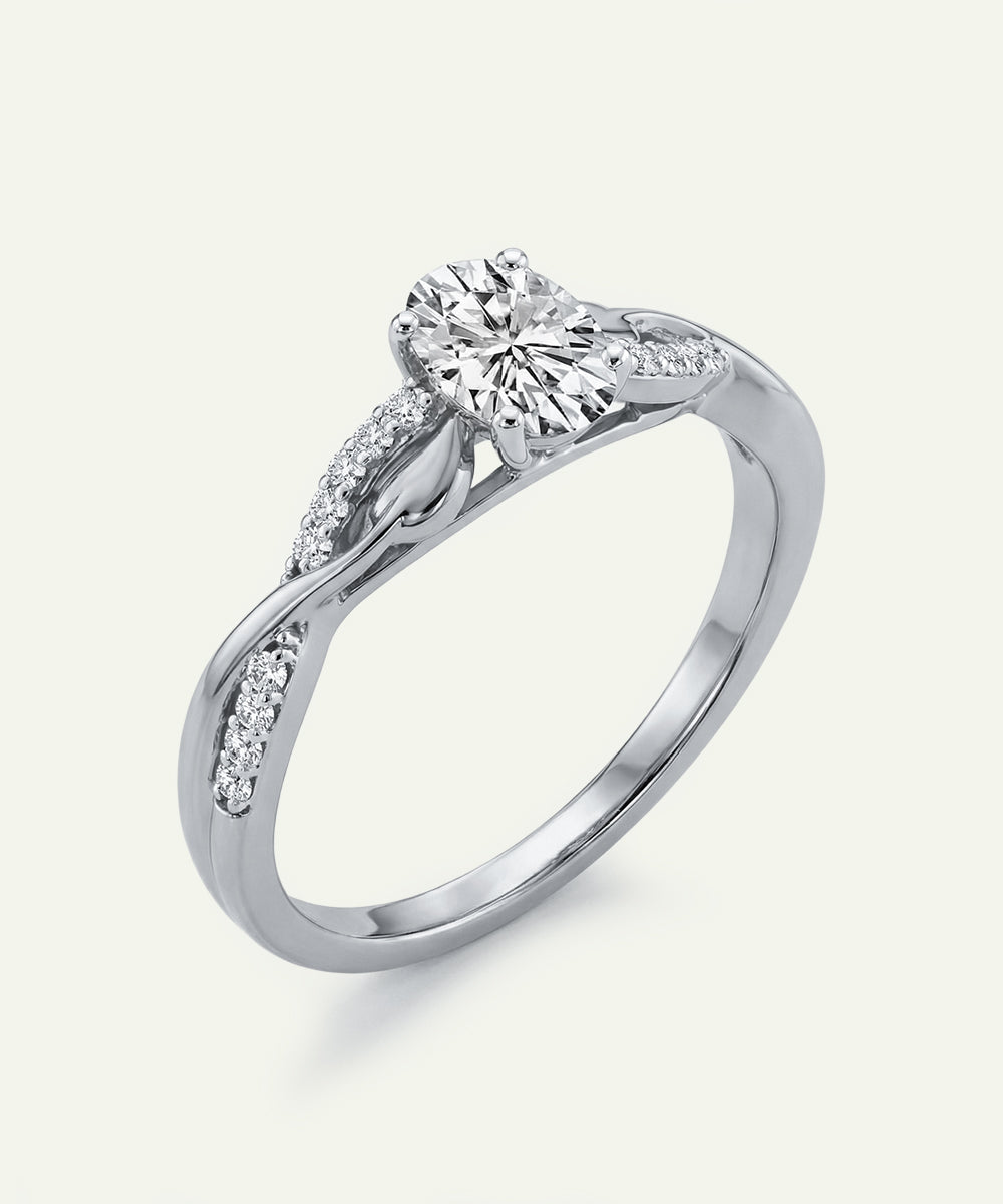 Silver ring with a diamond on a white background