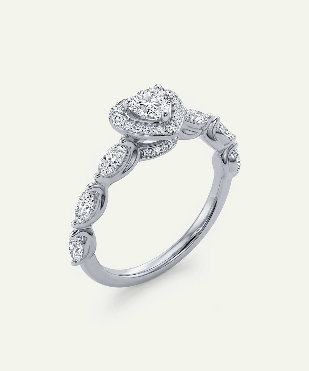 Silver ring with diamond accents on a light gray background