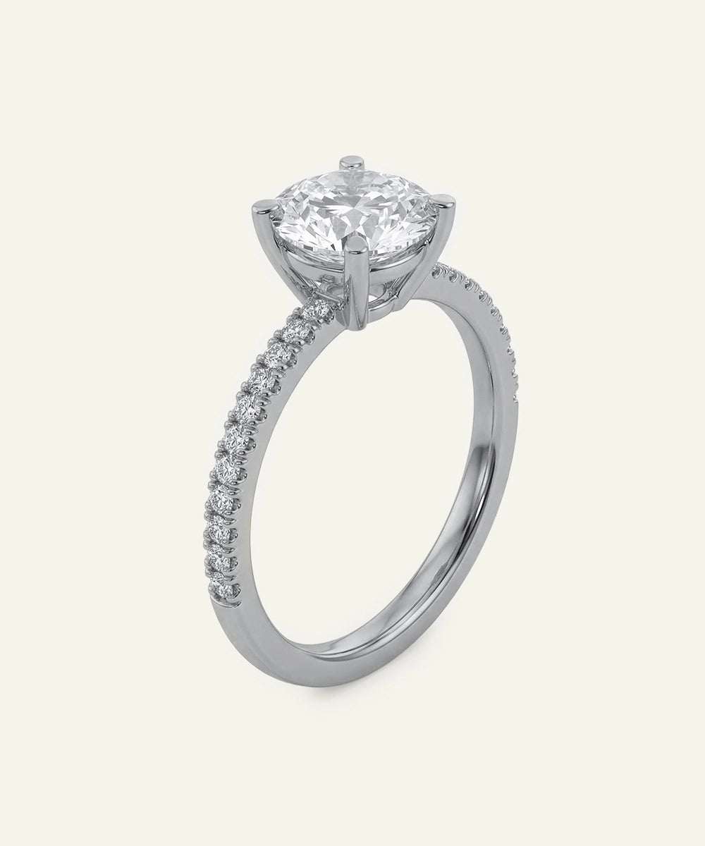 Diamond ring with a central gemstone and smaller diamonds on a white background