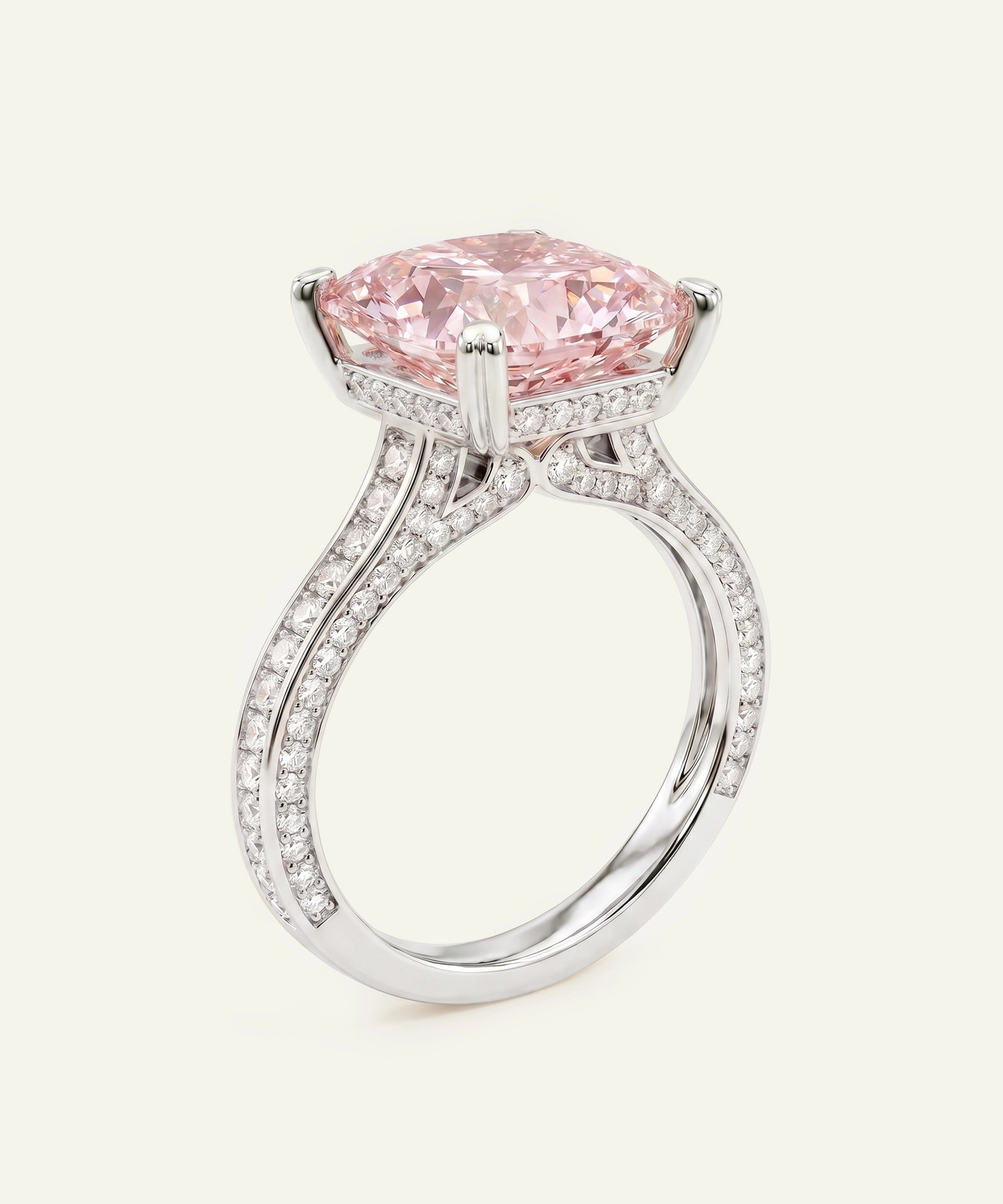 Ring with a pink diamond and white gemstones on a white background