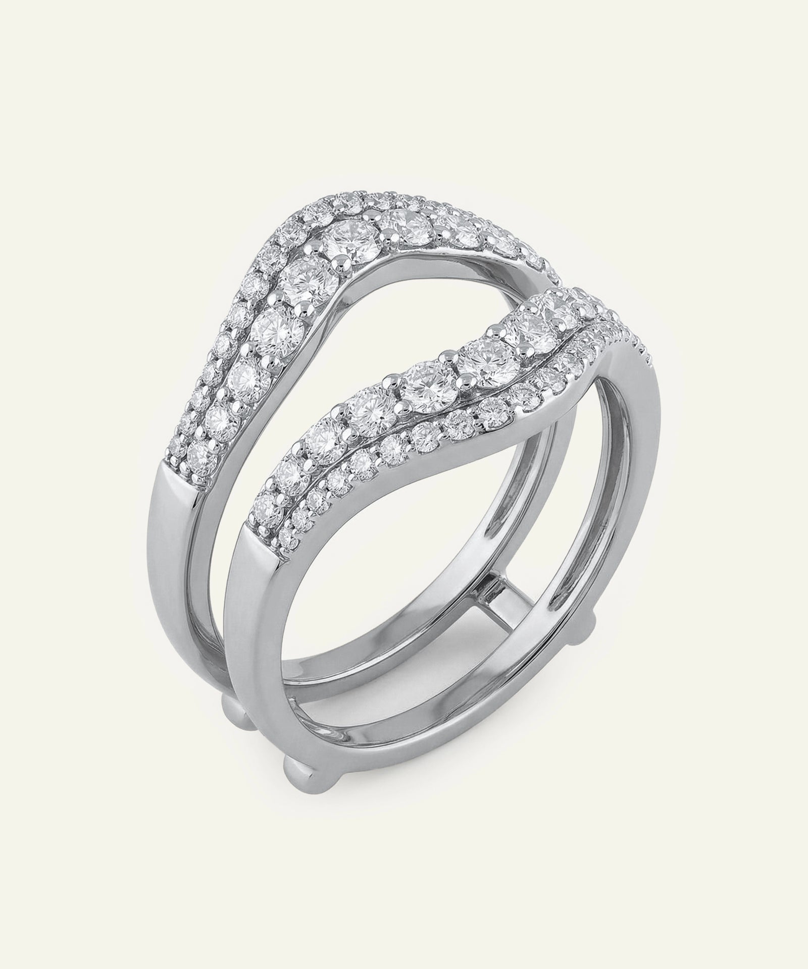 Silver ring with diamond accents on a light gray background