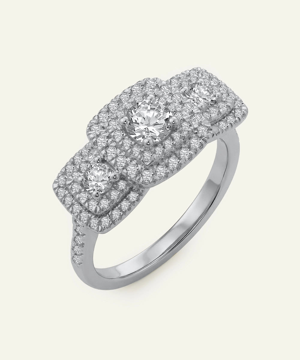 Diamond ring with a white gold band on a light gray background