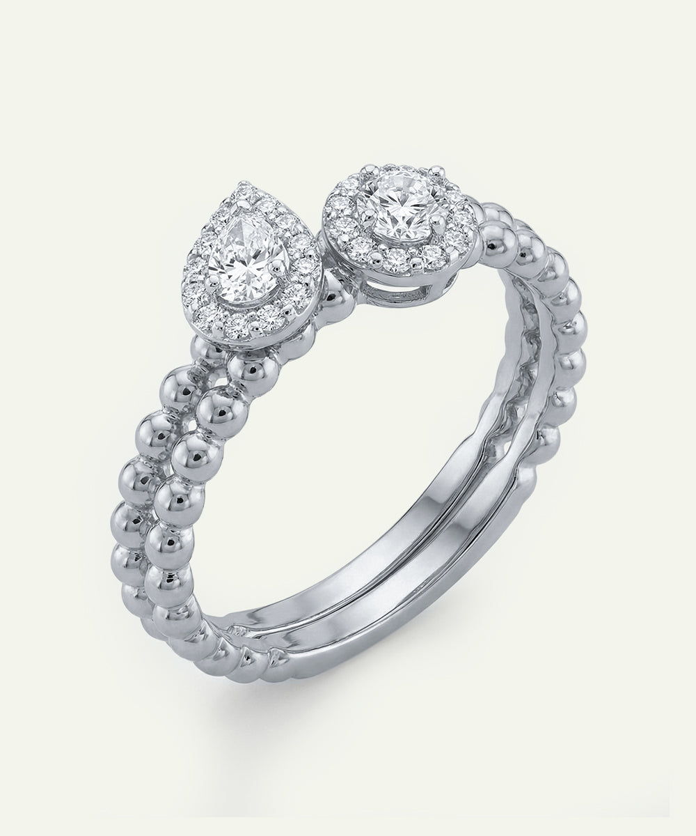 Silver ring with two diamond stones on a white background
