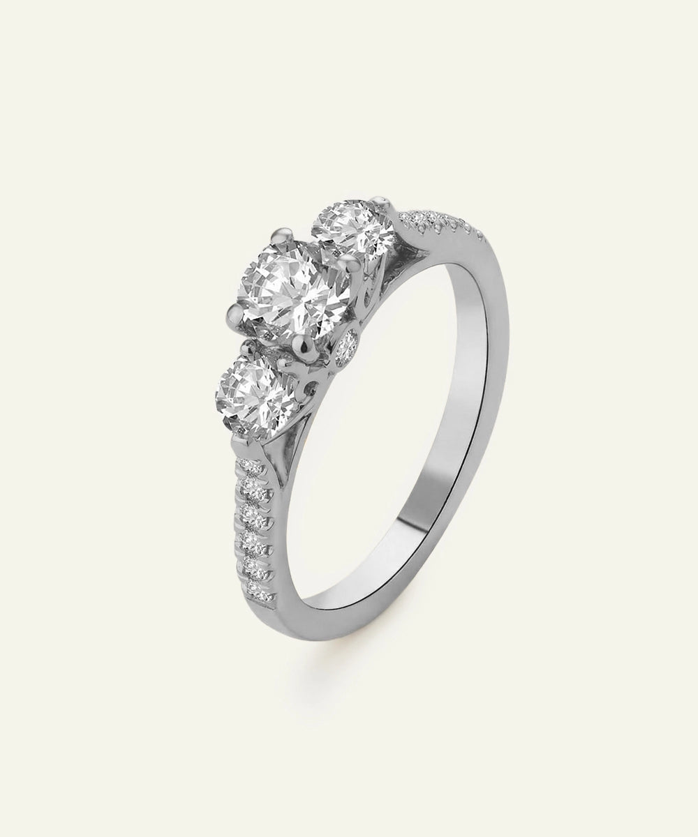 Silver ring with blue gemstones on a white background
