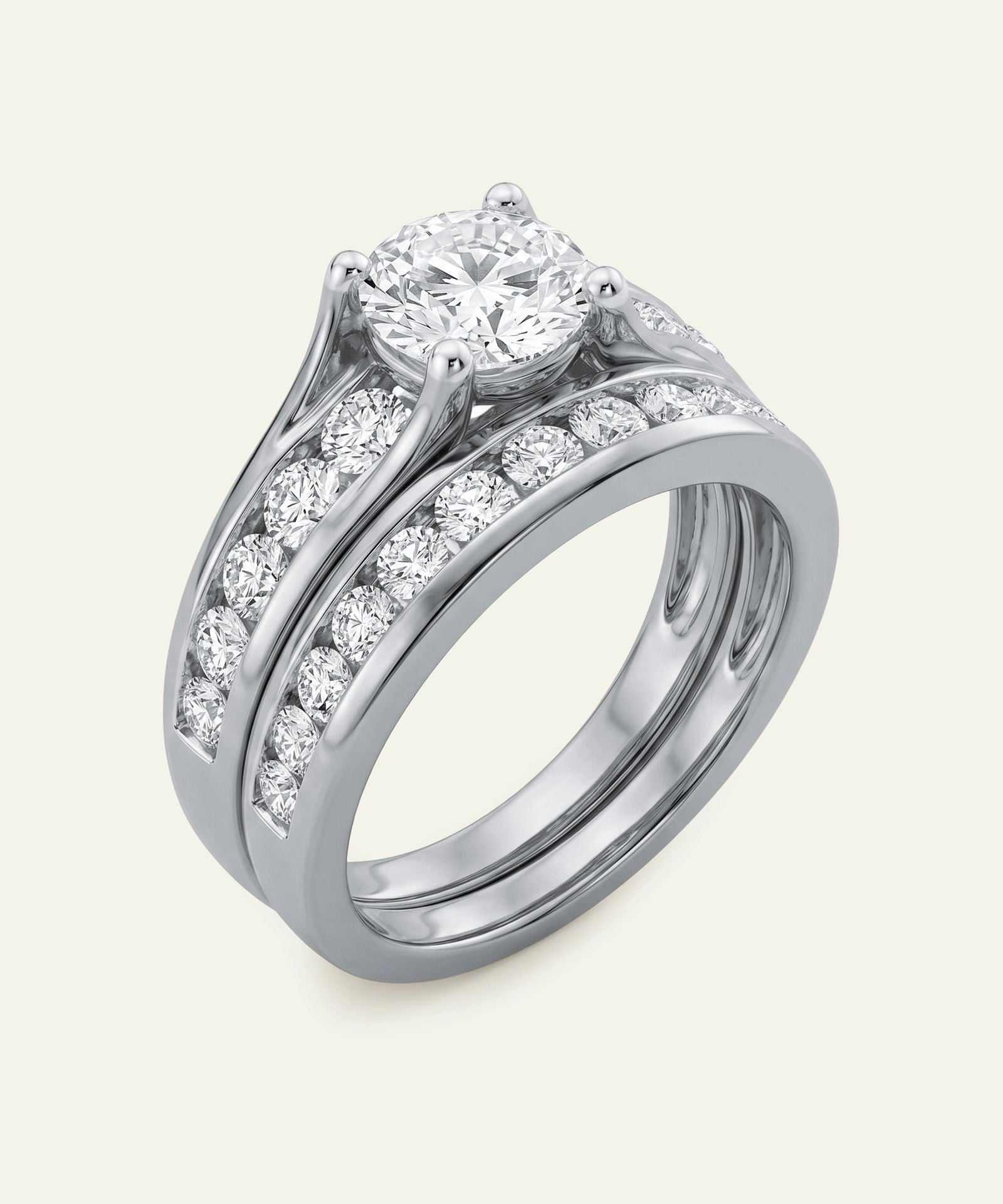 Diamond ring with a white gold band on a light gray background