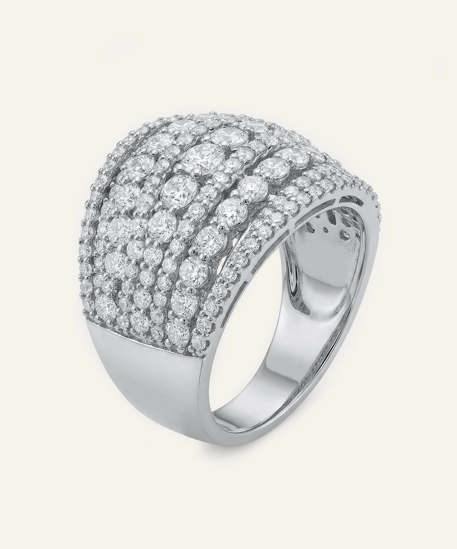 Silver ring with multiple rows of diamonds on a white background