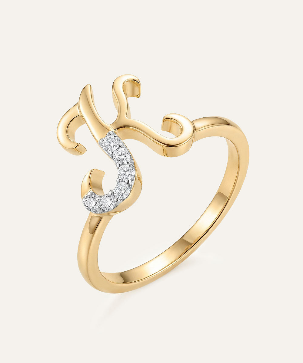Gold ring with a diamond on a light gray background