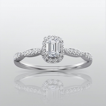A hand wearing a pear-shaped diamond halo ring